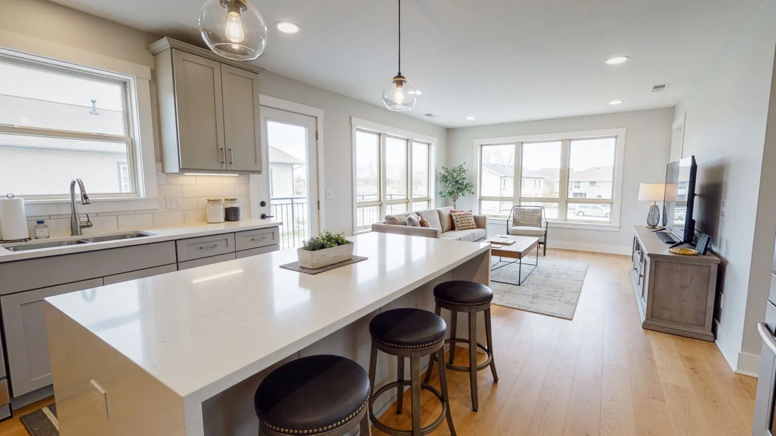 Bright open-concept kitchen and living room in a listing video